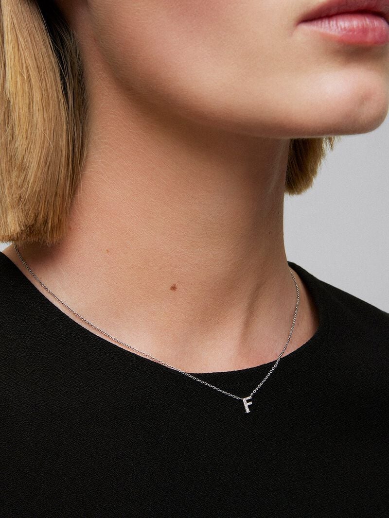 Pendant necklace with small initial in 18K white gold and diamonds. image number 1