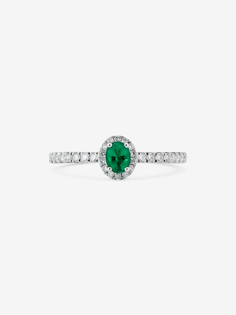 18K white gold ring with a 0.25 ct oval-cut green emerald and brilliant-cut diamond border totaling 0.25 cts image number 2
