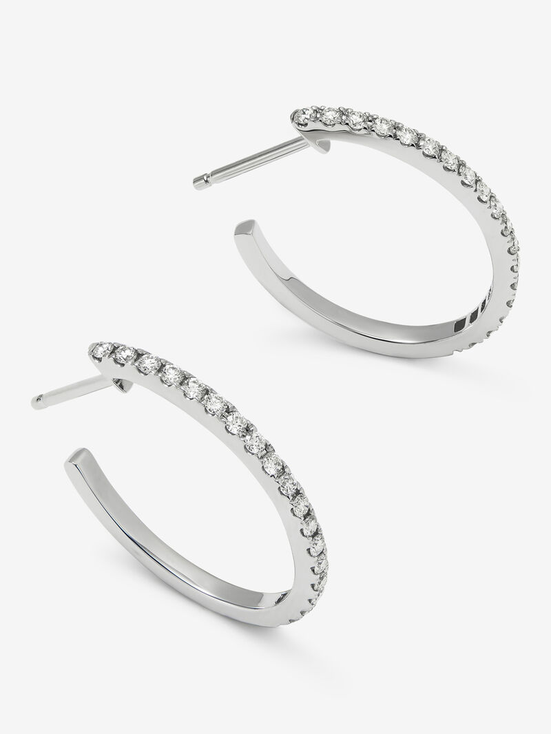 Thin hoop earrings made of 18K white gold with diamonds. image number 5