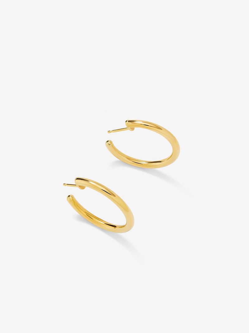 Medium smooth hoop earrings in 18K yellow gold. image number 2