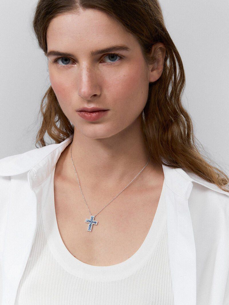 18kt white gold cross pendant with diamonds and blue sapphires. image number 0