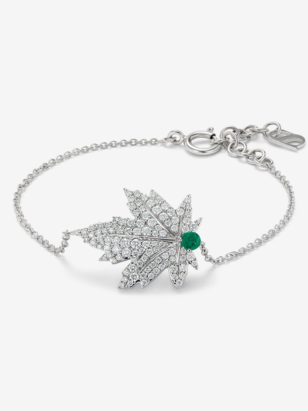 18K white gold bracelet with a 0.1 ct central emerald, diamond pavé, and a maple leaf design