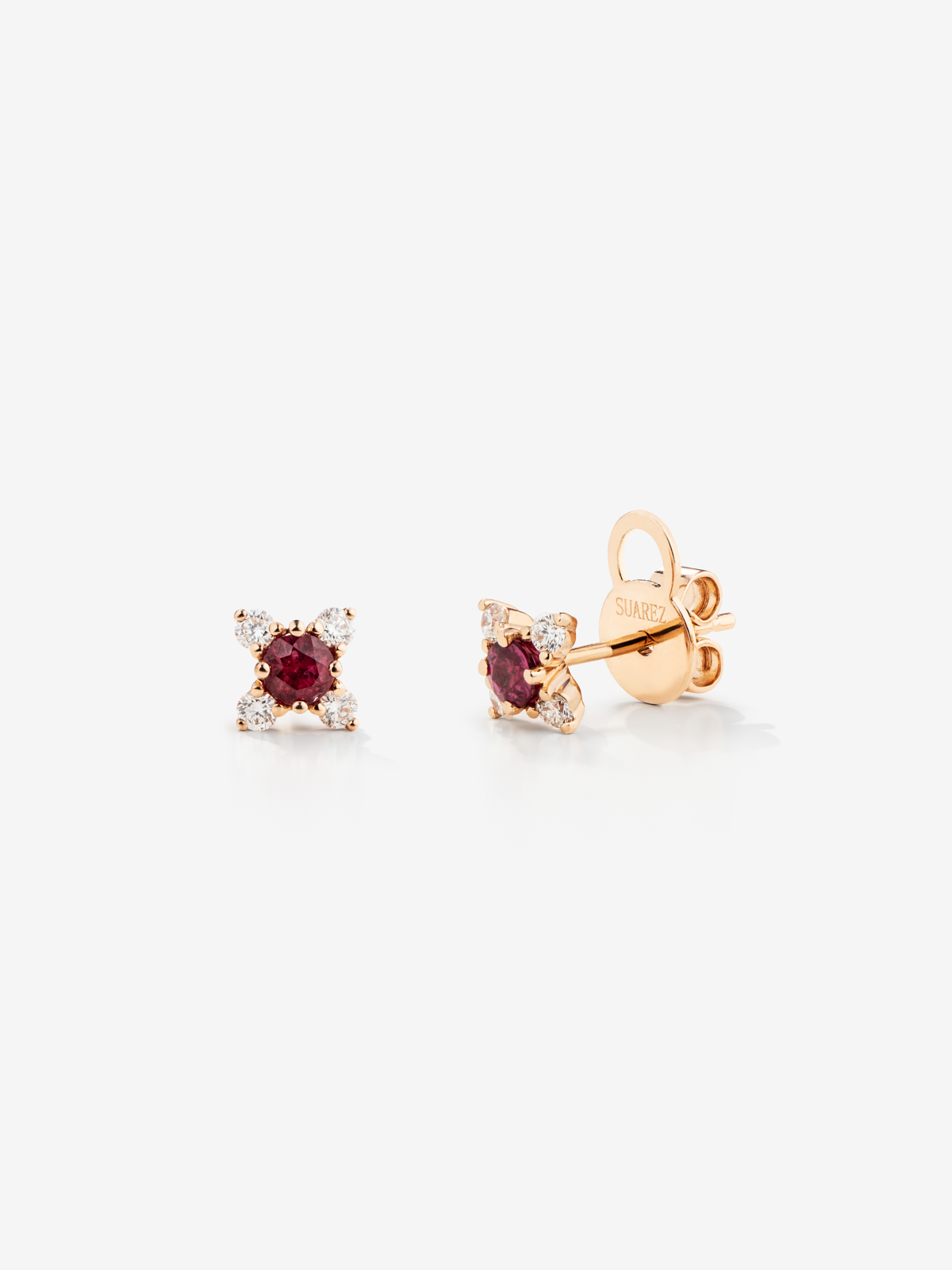 Individual 18K rose gold flower earring with ruby and diamonds.