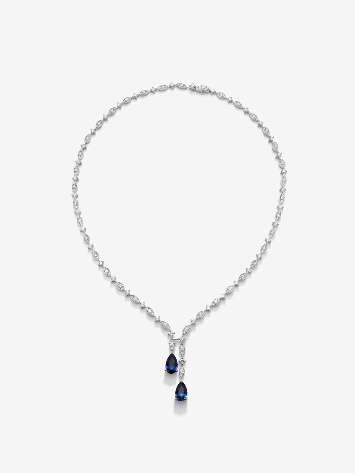 18K white gold necklace with intense blue zafiro in 1.76 cts pear size, emerald green in 0.96 cts and white diamonds in a bright size of 6.48 cts
