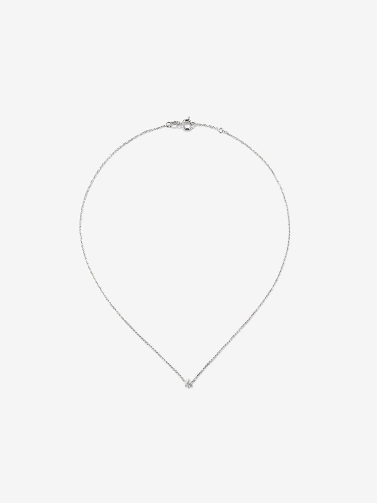 Colgante de oro blanco de 18K y diamantes en talla brillante de 0,08 cts y forma de estrella