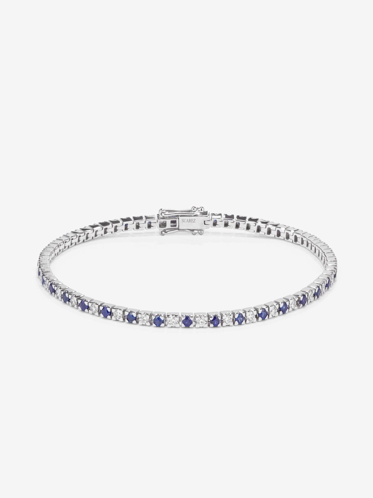 Pulsera riviere de oro blanco de 18K con diamante y zafiro