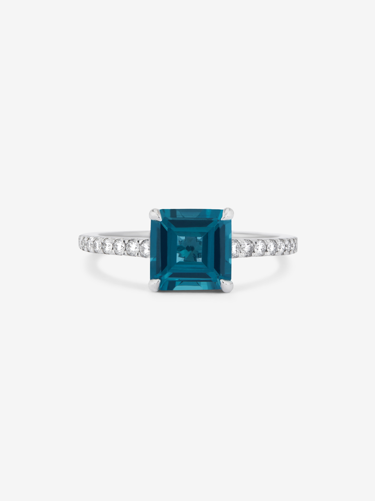 Anillo solitario de oro blanco de 18K con topacio y diamante