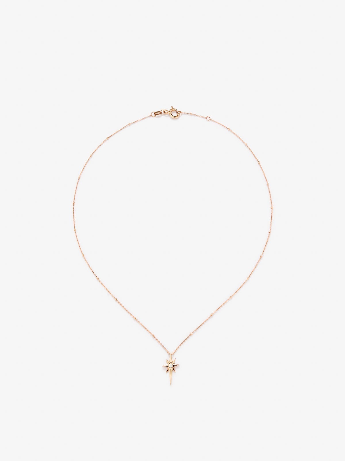 Colgante cadena con estrella de oro rosa de 18K con diamante