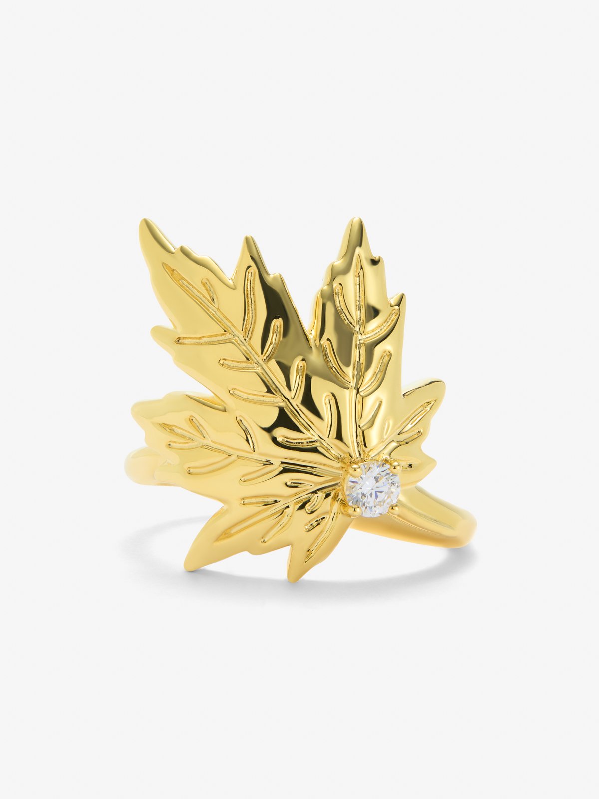Anillo de oro amarillo de 18K con diamante central en talla brillante de 0,12 cts y forma de hoja de arce 