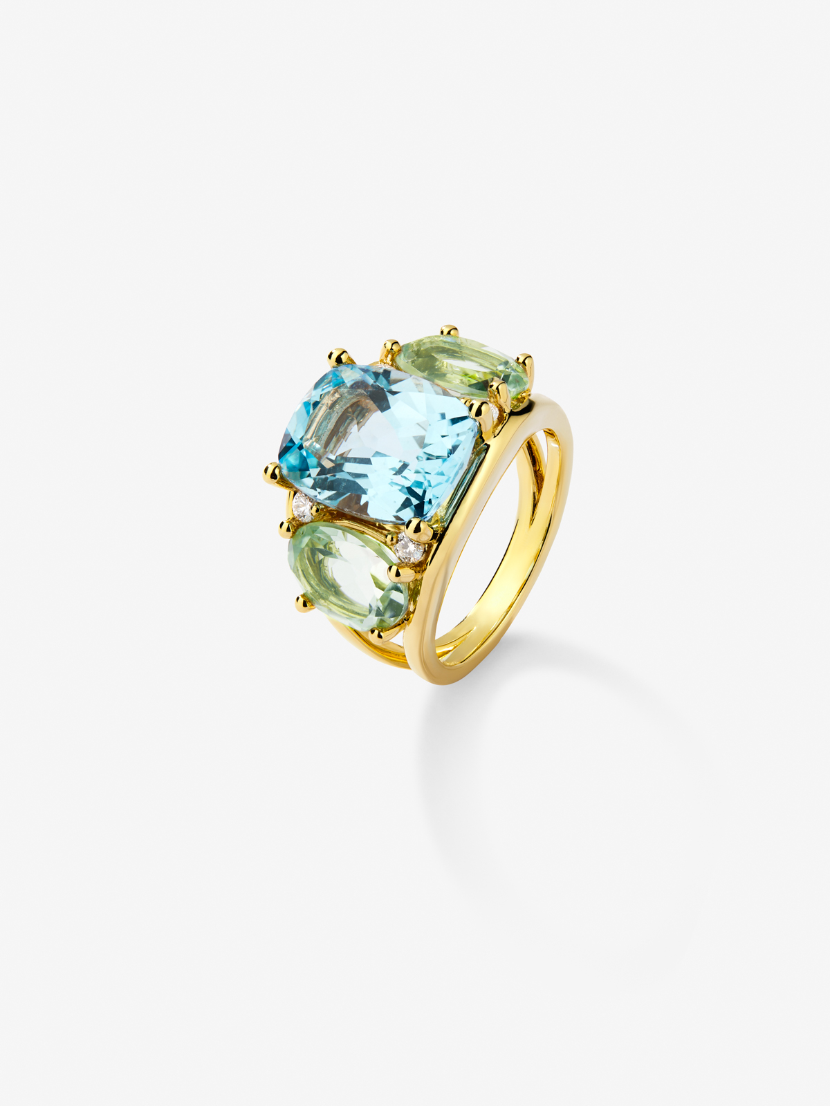 18K yellow gold ring with blue Sky Topacio in 5.5 cts Cushion size, green -sized icatists of 4.65 cts and white diamonds in a brilliant size of 0.15 cts