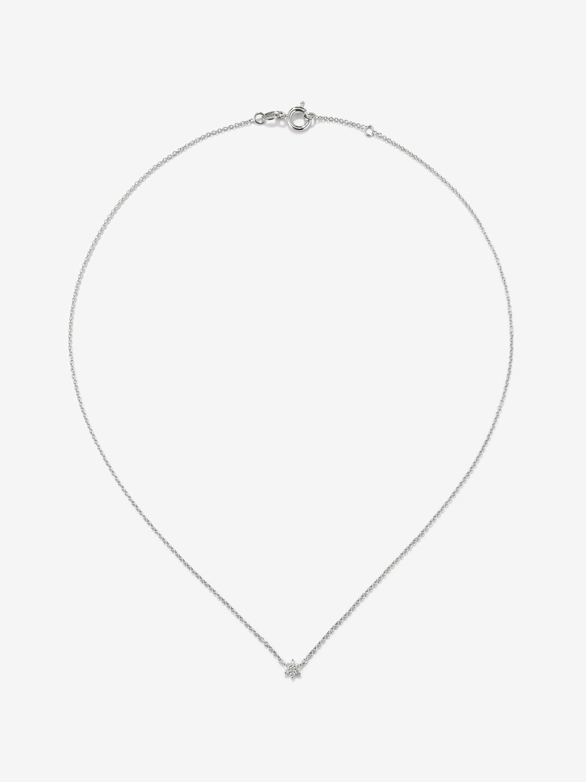 Colgante de oro blanco de 18K y diamantes en talla brillante de 0,08 cts y forma de estrella