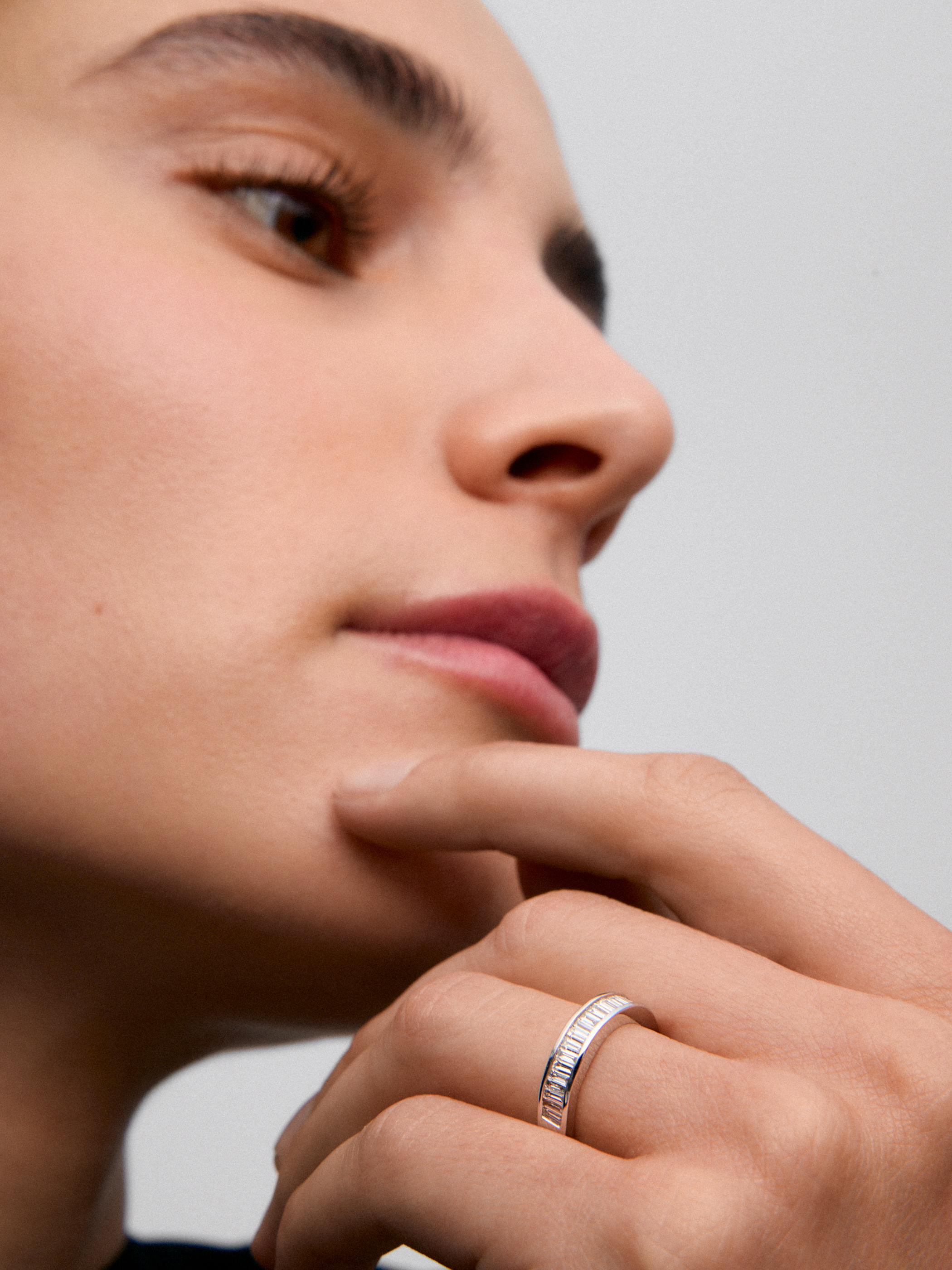 Half band ring in 18K white gold with half-circle of baguette-cut diamonds totaling 0.63 cts