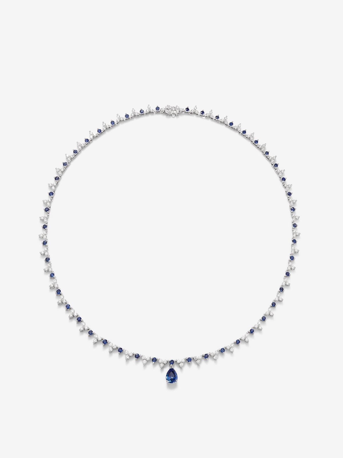 18K white gold necklace with Royal blue sapphire in 1.25 cts pear size, blue sapphires in 2.96 and white diamonds in bright size of 4.27 cts