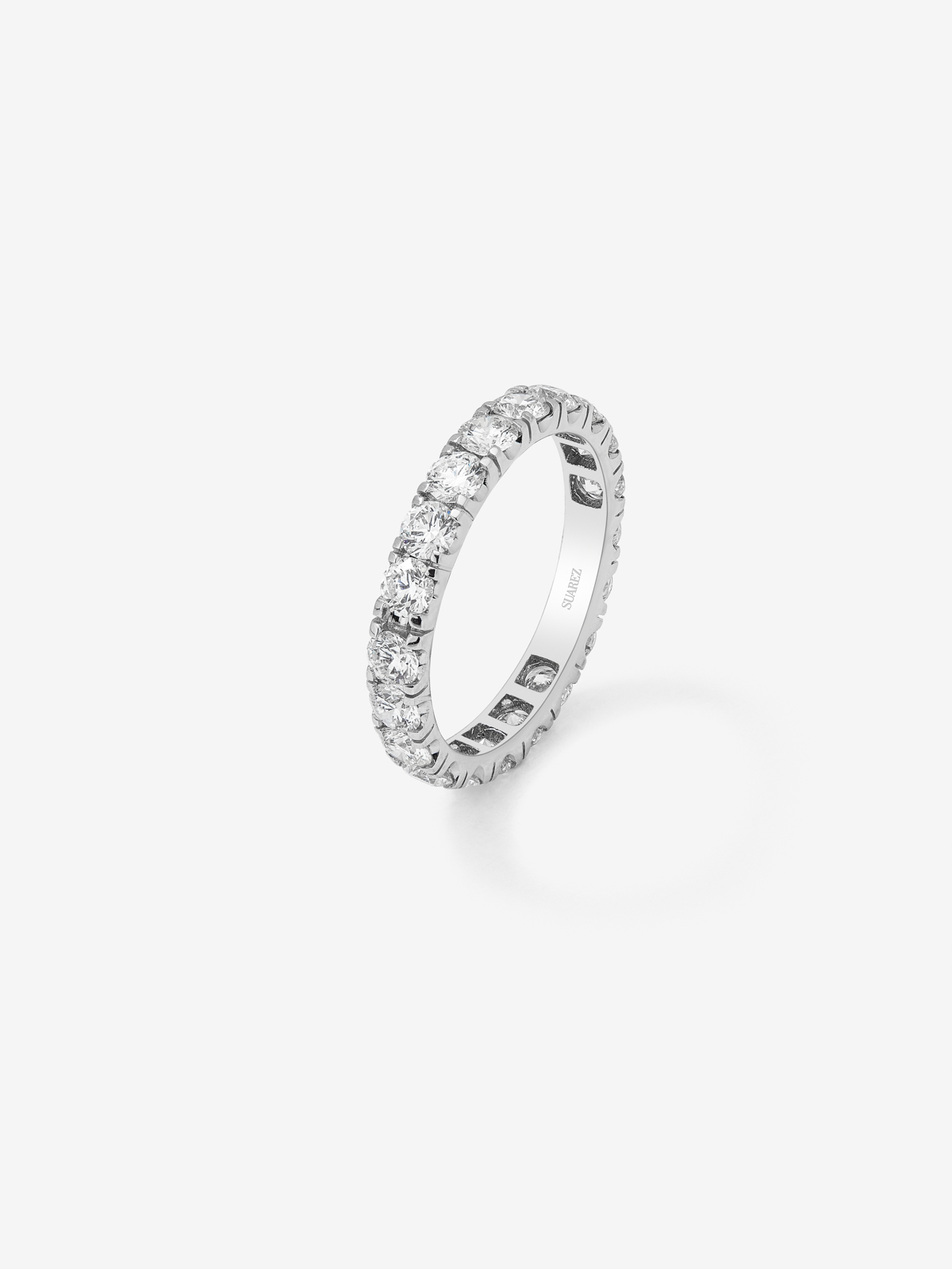 18K white gold full eternity engagement ring with claw-set diamonds.