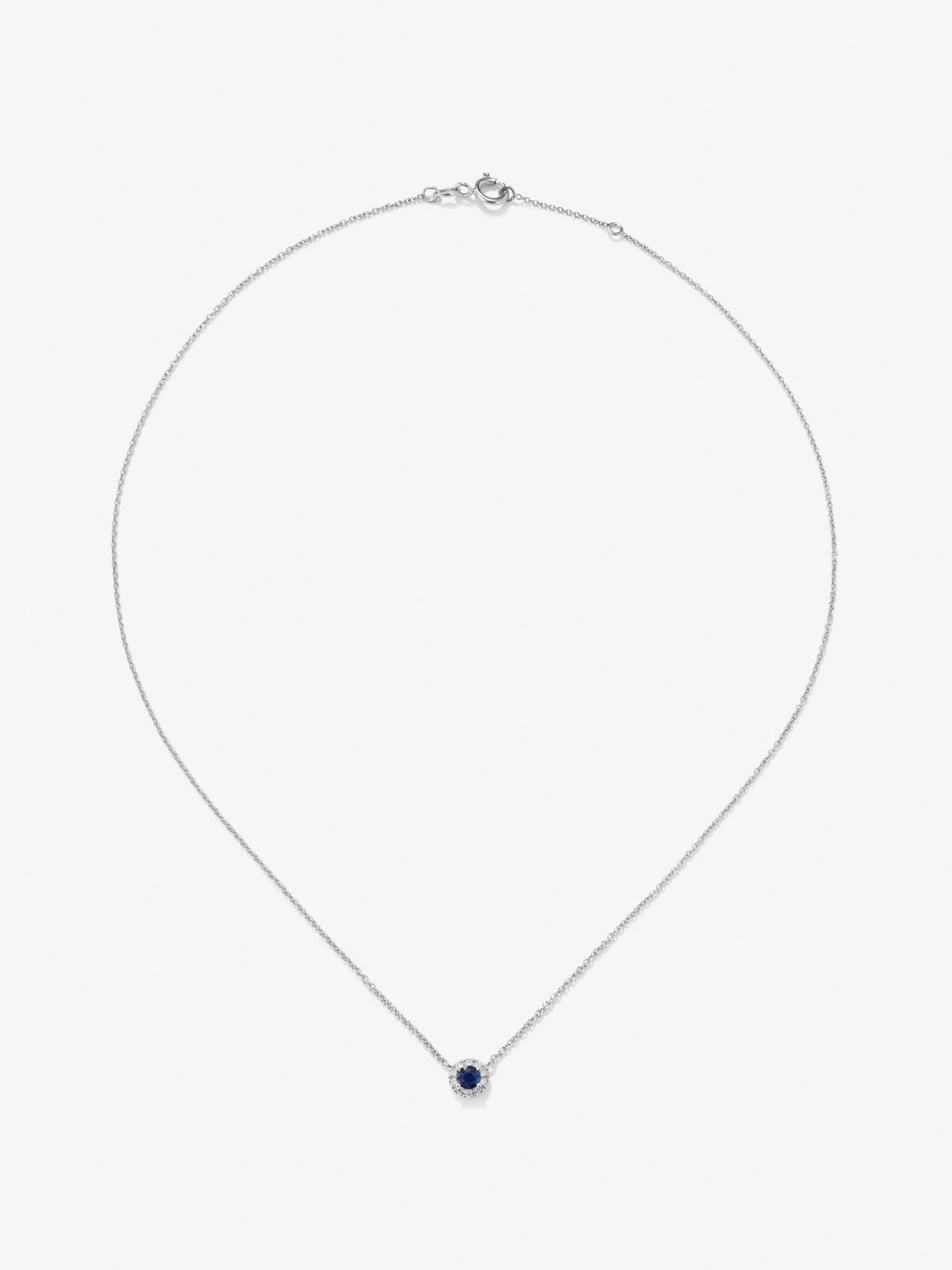 Colgante de oro blanco de 18K con zafiro azul en talla brillante de 0,31 cts y diamantes en talla brillante de 0,87 cts