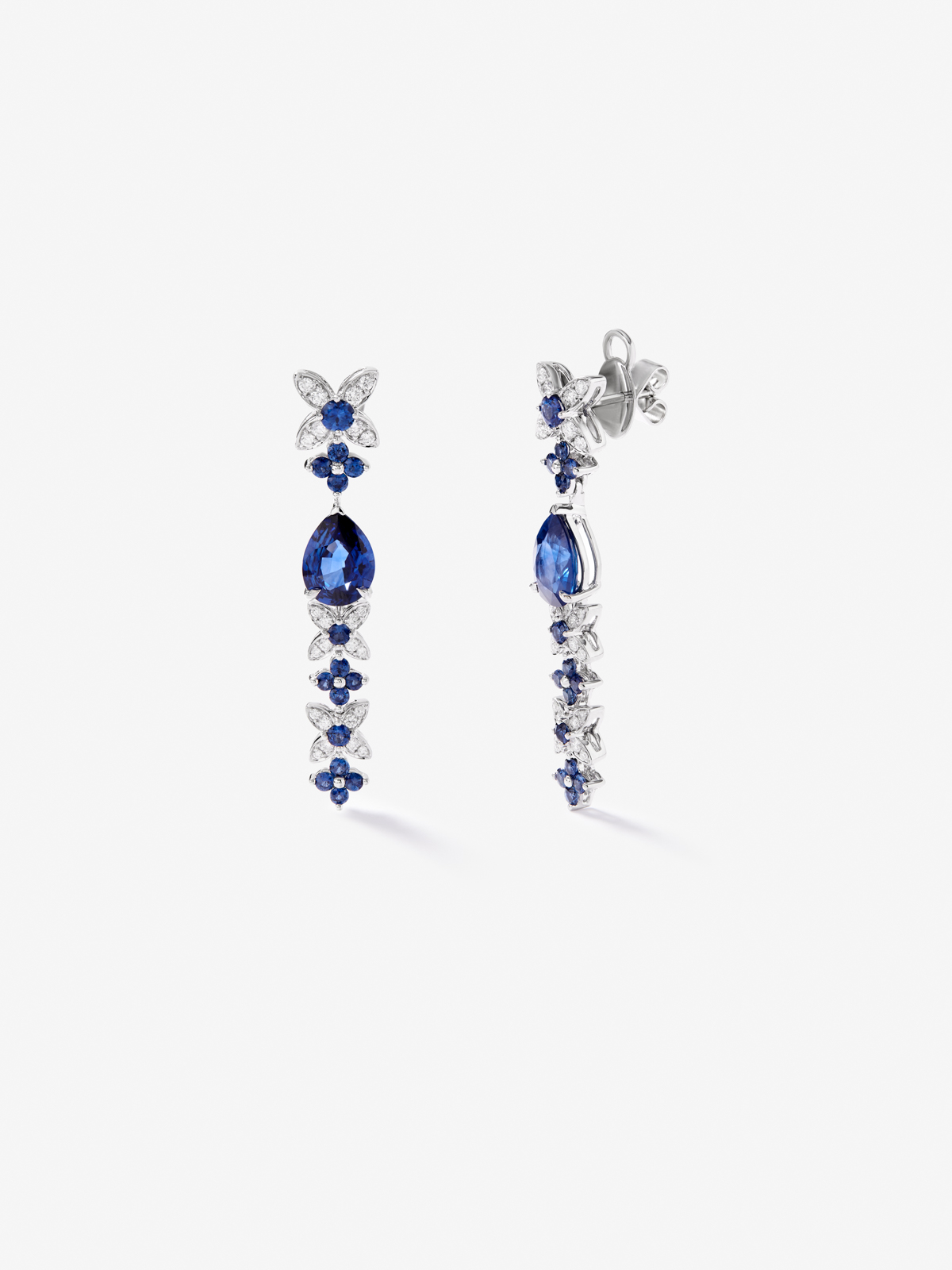 18k white gold earrings with royal blue sapps in pear size 4.05 cts, blue sapphires in bright size 1.27 cts and white diamonds in a bright size of 0.5 cts
