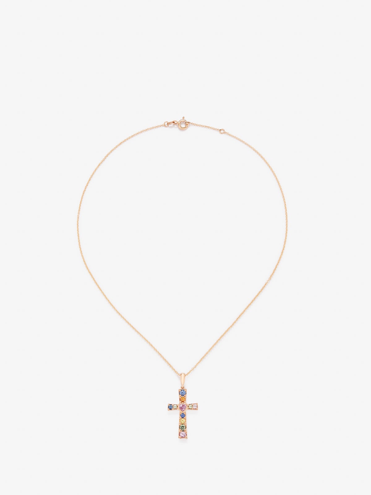 Colgante cadena cruz de oro rosa de 18K con zafiro